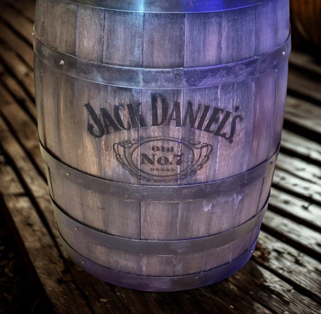 Crafted Casks hero with whiskey barrels and a handmade lantern